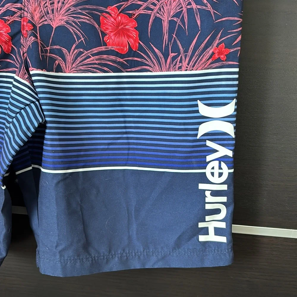 Hurley Boy’s Blue and Red Board Shorts with Tropical Design