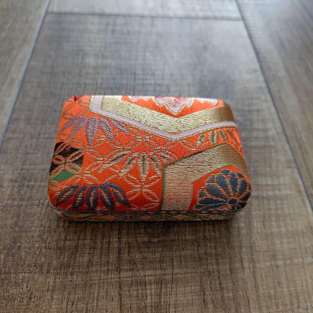 Case with orange pattern for Koto and 3 Koto picks