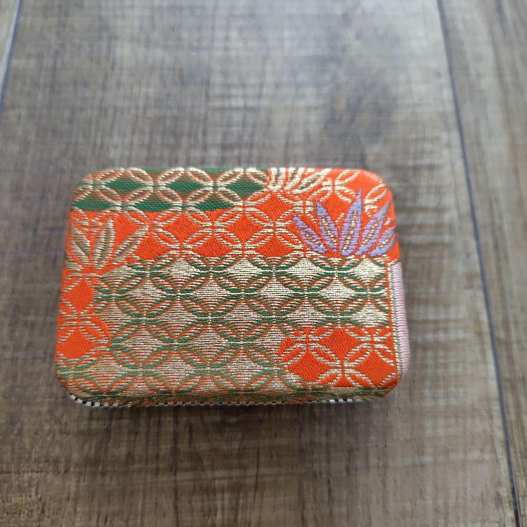 Case with orange pattern for Koto and 3 Koto picks