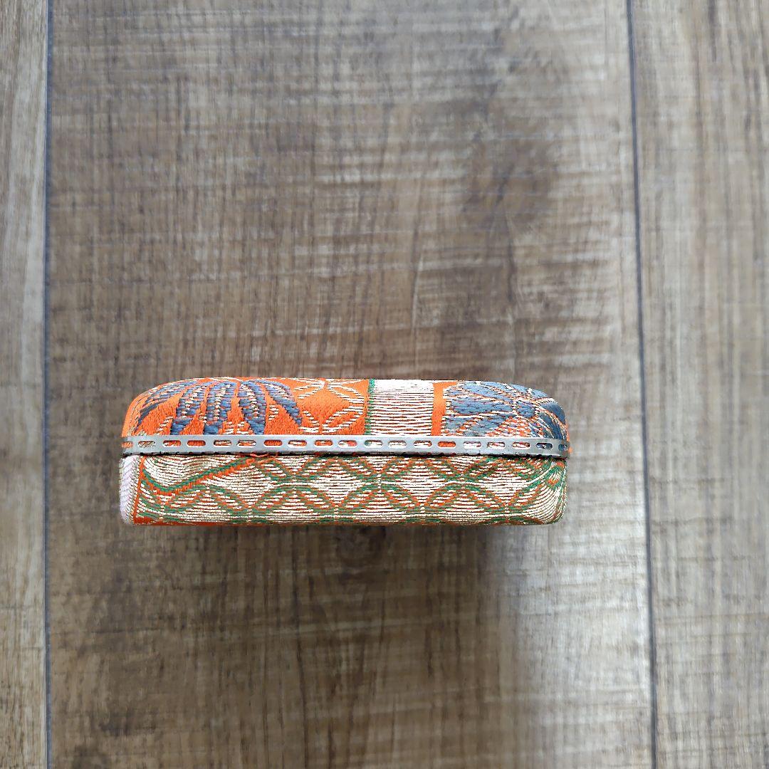 Case with orange pattern for Koto and 3 Koto picks