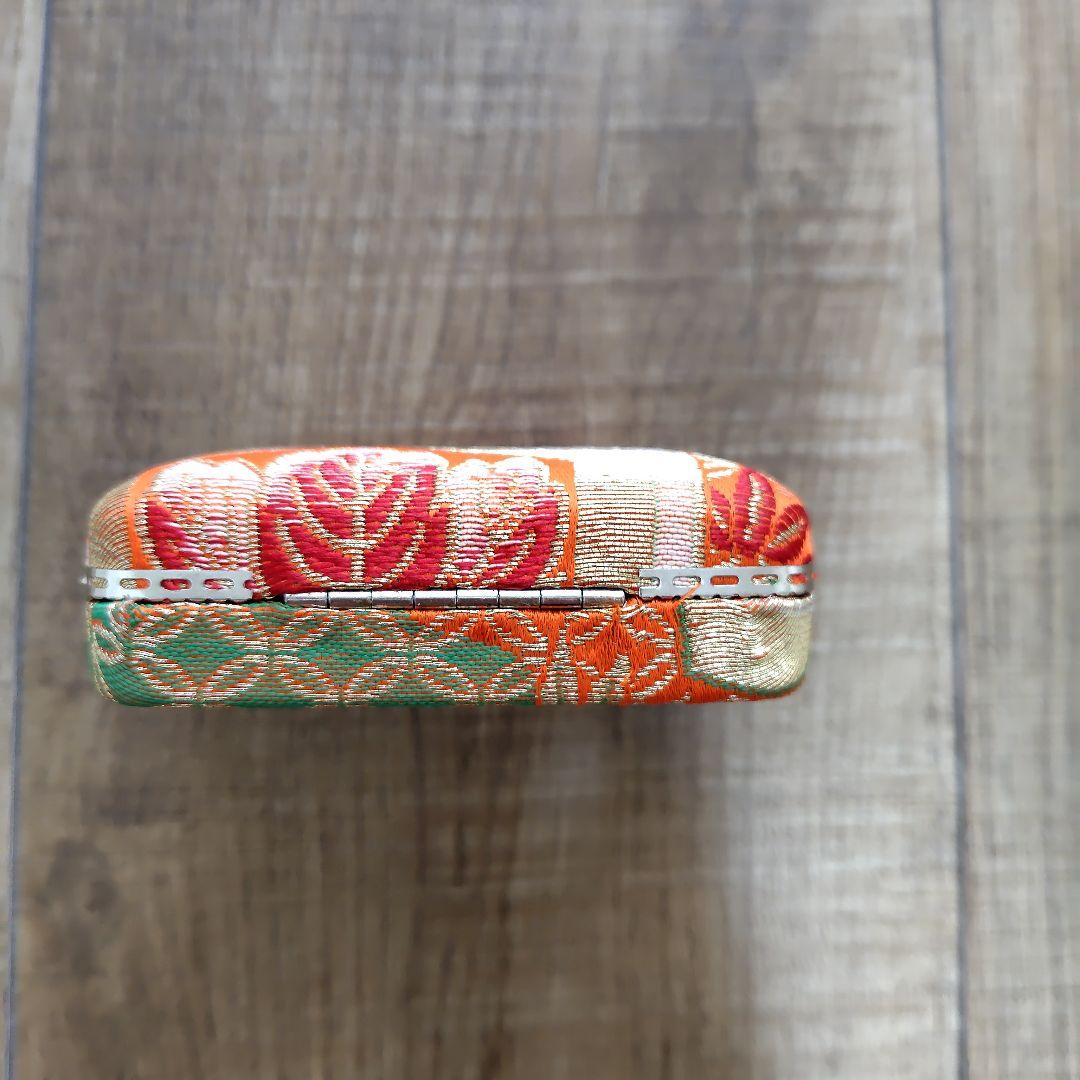 Case with orange pattern for Koto and 3 Koto picks