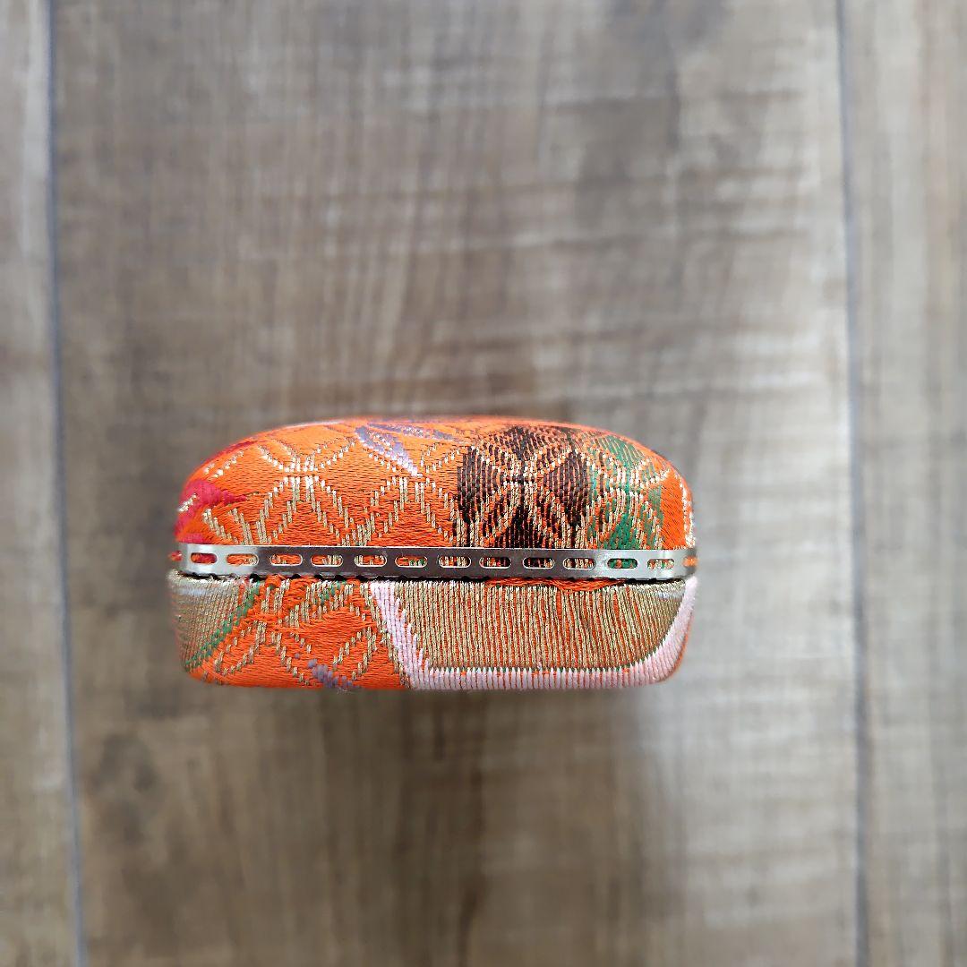 Case with orange pattern for Koto and 3 Koto picks