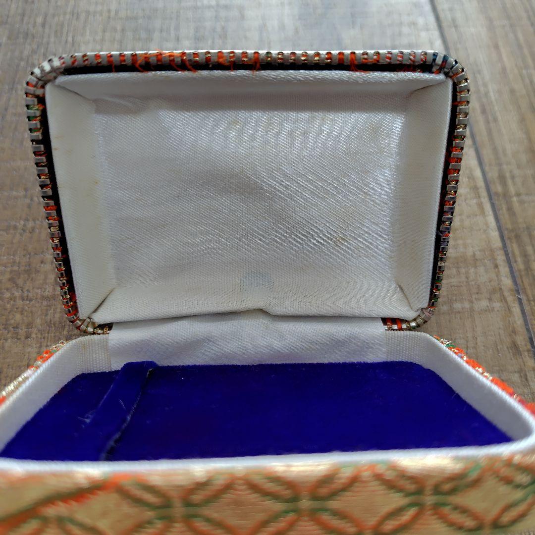 Case with orange pattern for Koto and 3 Koto picks